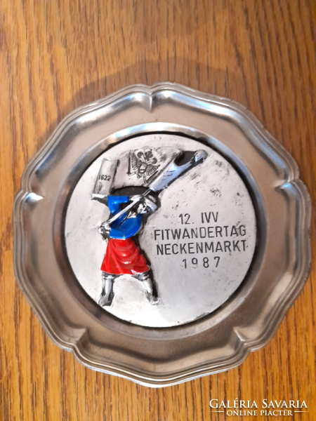 Old souvenir from Austria on a tin wall plate