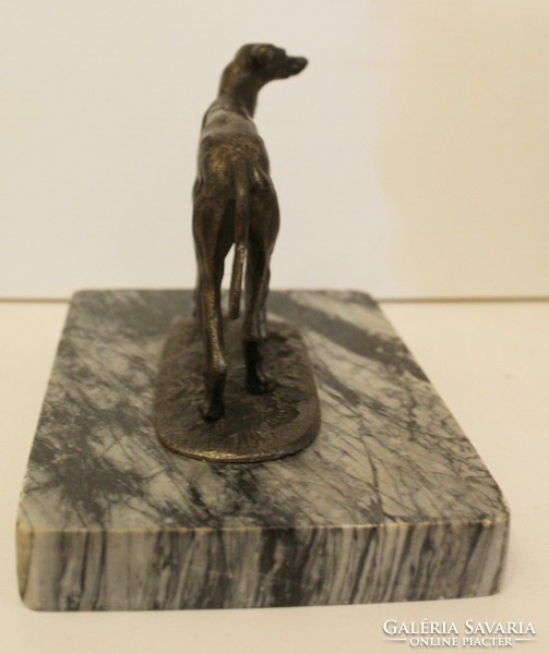 Bronze greyhound sculpture on a marble pedestal