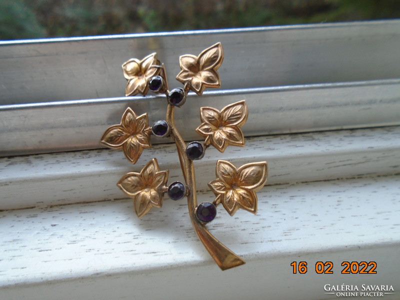 Antique gold-plated brooch with dark purple faceted stones