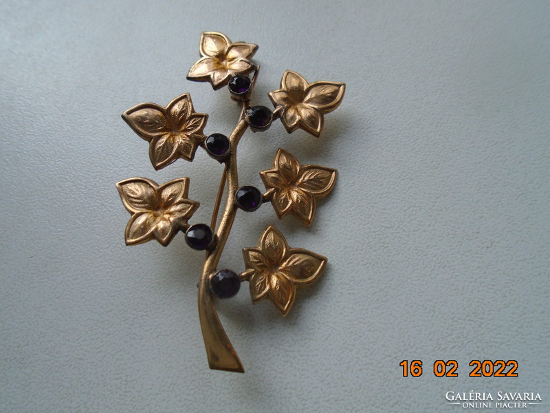 Antique gold-plated brooch with dark purple faceted stones