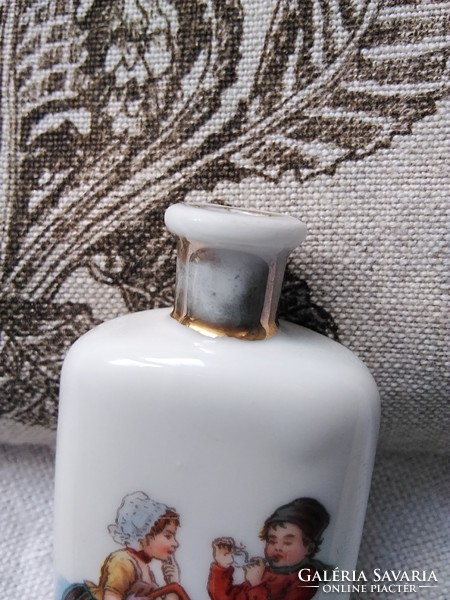 Antique partly hand painted porcelain perfume with Dutch folk costume motif