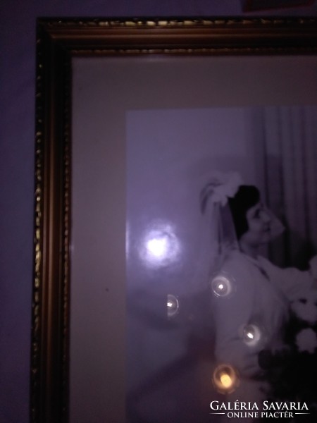 Retro gilded photo frame with wedding photo