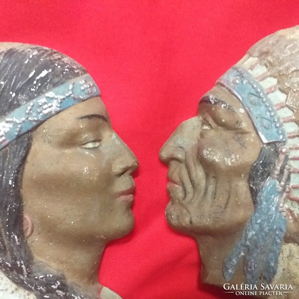 Old cast aluminum painted Native American couple wall ornament.