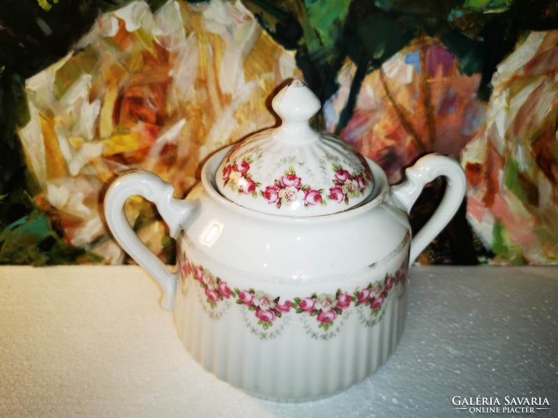 Pink porcelain sugar bowl from the early 1900s to the late 1980s.