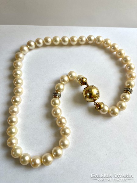 Exciting true pearl with 18k gold and over 1ct diamonds! It is embellished