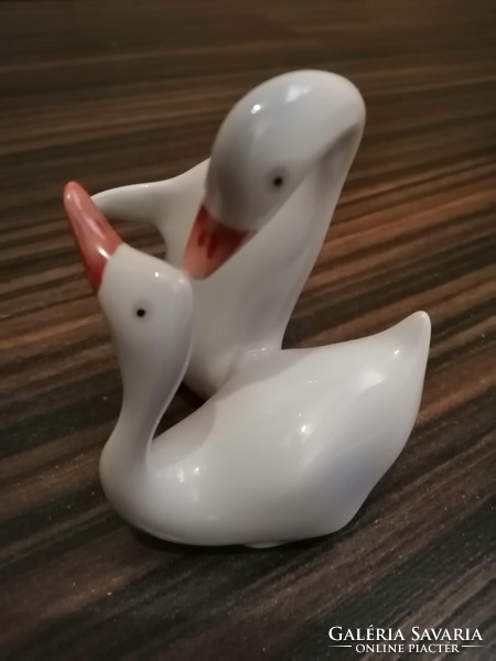 A pair of raven house swans, marked, hand-painted, numbered