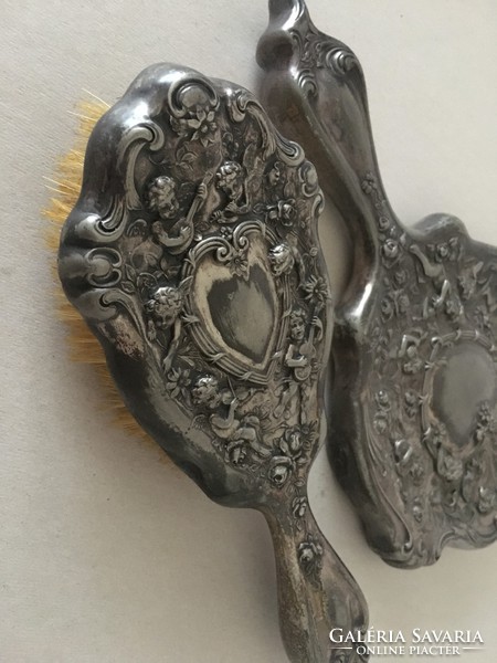 Antique silver plated hand mirror and hairbrush with putties