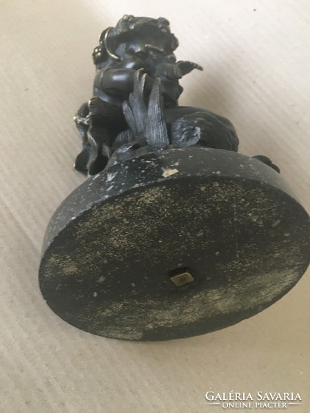 Old bronze faun on marble base