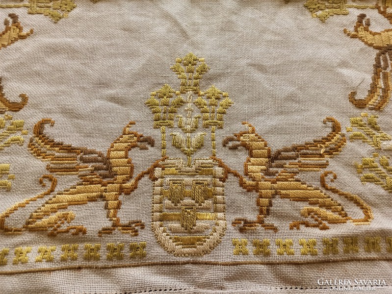 Embroidered tablecloth with griffin coat of arms