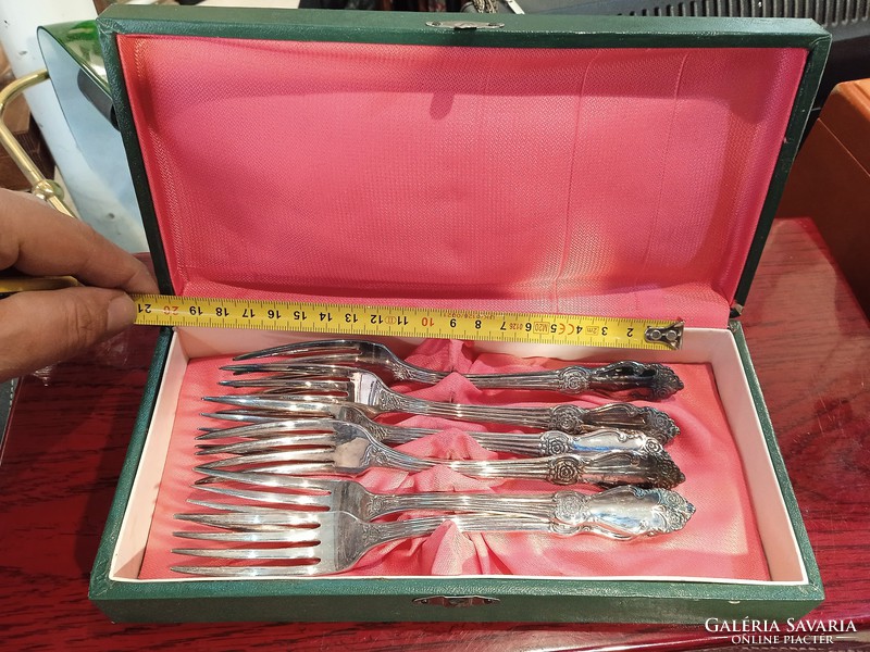 Silver-plated fork, dessert set, in original box, on Soviet festive table.