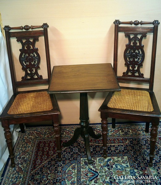 Carved 2 chairs with mahogany table.