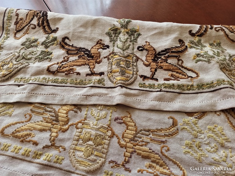 Embroidered tablecloth with griffin coat of arms