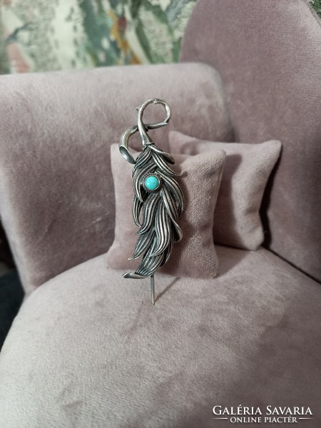 Silver brooch with turquoise
