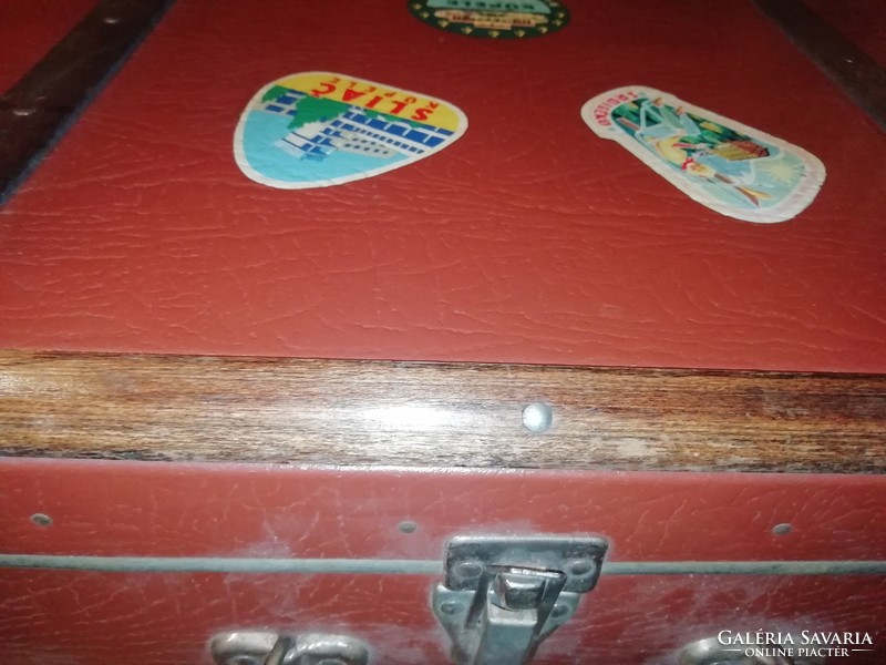 Antique travel suitcase with wooden sticker