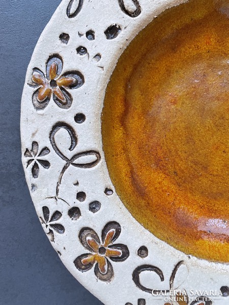 Handcrafted ceramic plate with amber glaze