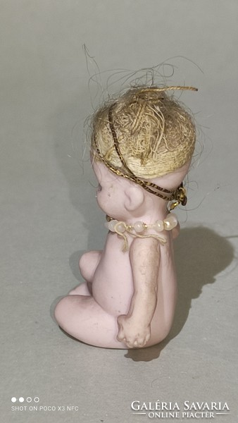 Antique porcelain is a very rare marked mini sitting doll