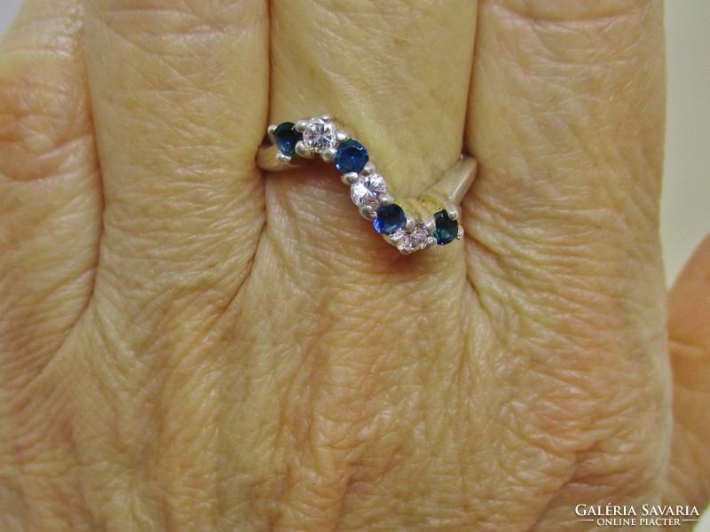 Beautiful wavy silver ring with blue and white stones