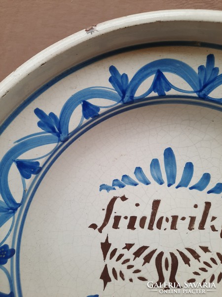 Tin glazed bowl with friderika inscription