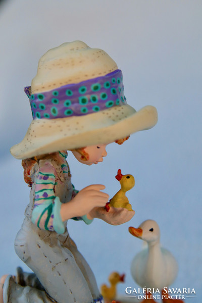 Little girl with ducks. Sarah kay statue with certificate