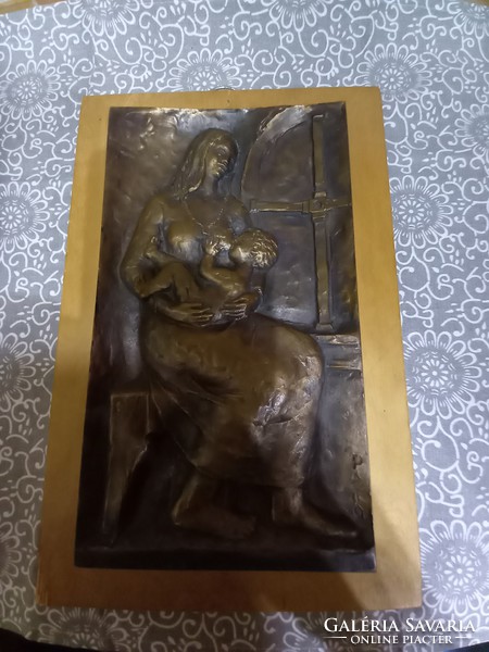 Hoof rose bronze relief: motherhood