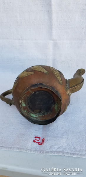 Antique ornate hand hammered oriental tea spout.