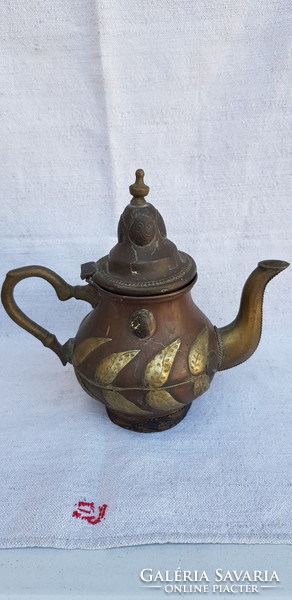 Antique ornate hand hammered oriental tea spout.