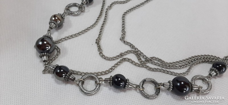Four-row long black beaded necklace