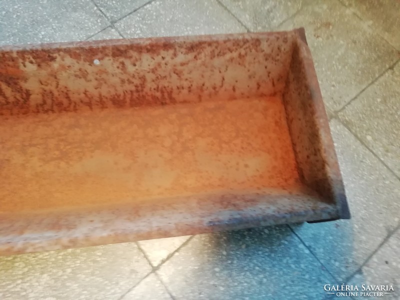 Old small iron drinking trough, decorative object