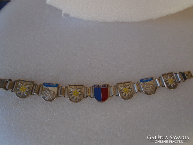 The material of an old but beautifully crafted bracelet is unknown, about 2 cm wide