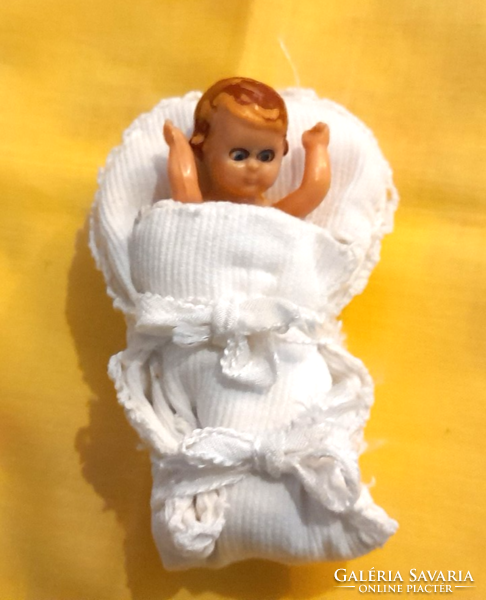 Old dollhouse sleeping doll