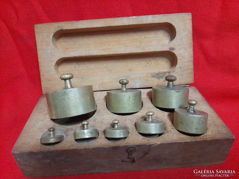 Old certified copper weight set in wooden box.