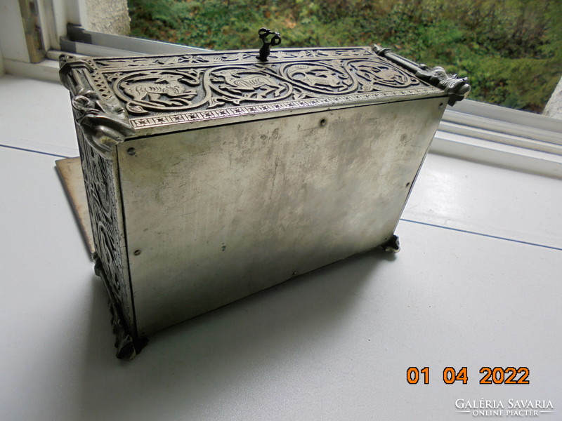 Wrought iron box with rosewood lining with gothic relief with animal patterns and winged faun head columns