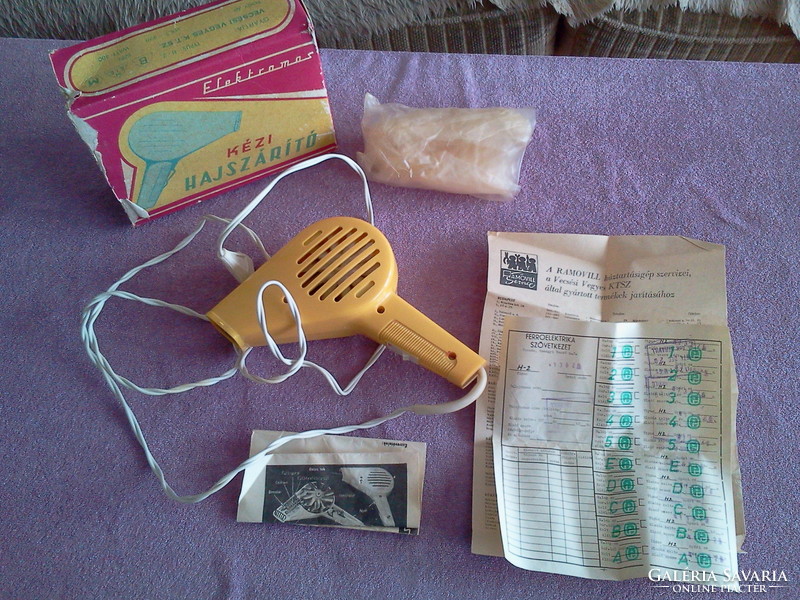 Retro hair dryer with original papers