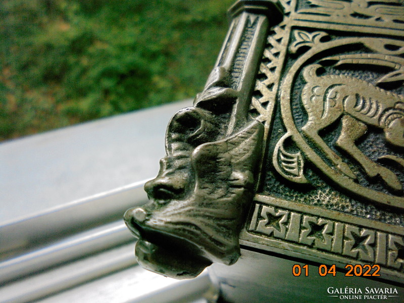 Wrought iron box with rosewood lining with gothic relief with animal patterns and winged faun head columns