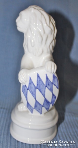 Porcelain lion figure with shield
