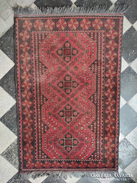 Red-toned hand-woven Afghan wool rug approx. 60 years old