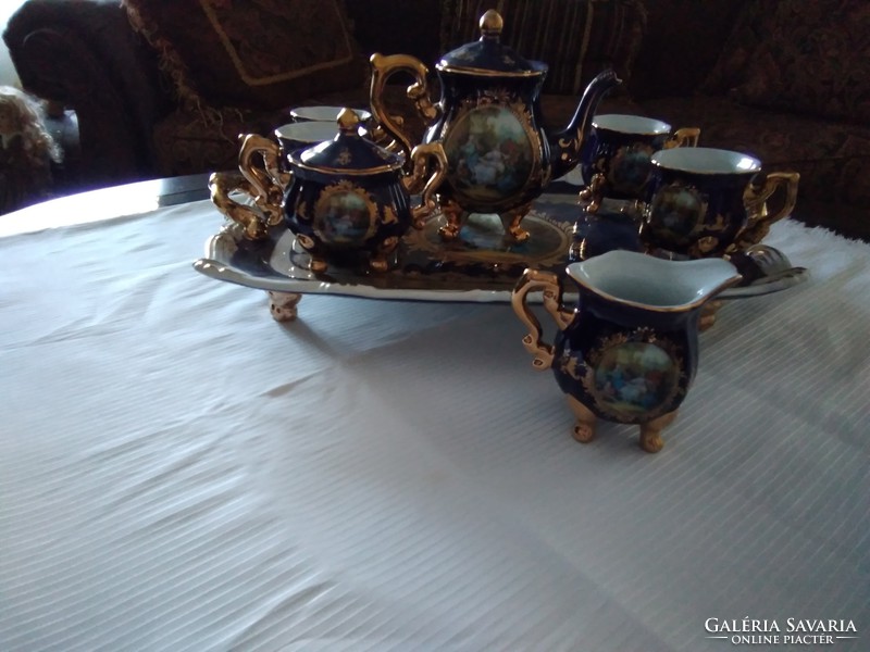 Coffee set of painted porcelain standing on legs