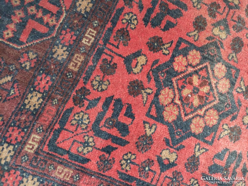 Red-toned hand-woven Afghan wool rug approx. 80 years old