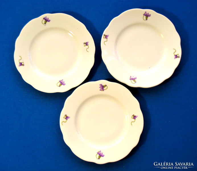 3 small plates with a violet pattern