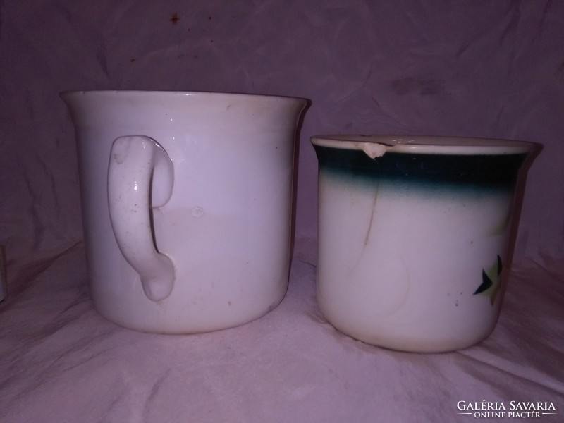 Two old granite mugs with sleeping milk - together