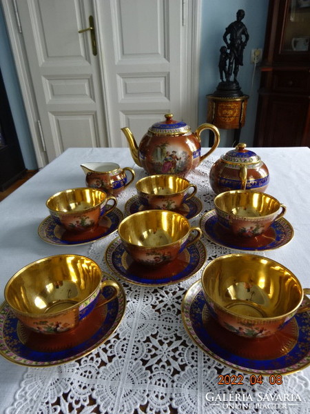 Zsolnay porcelain six-person antique tea set, scene, gold inside. He has!