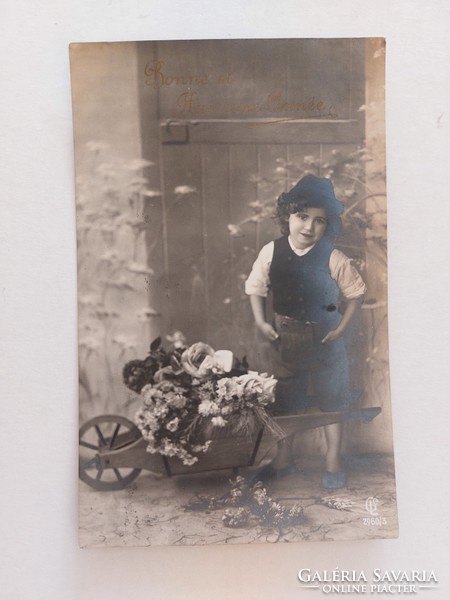 Old postcard photo postcard with little boy in wheelbarrow