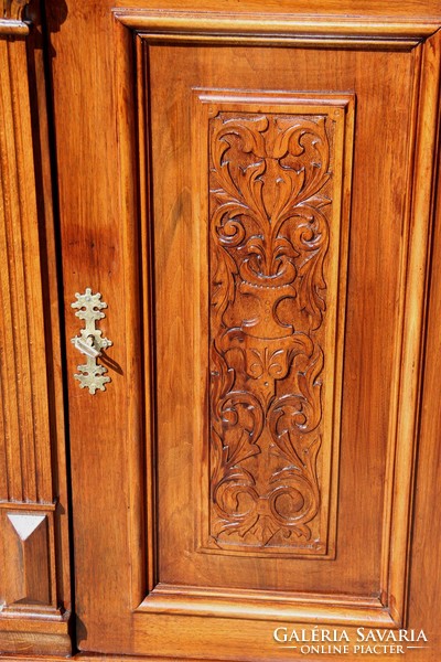 Old German richly carved chest of drawers