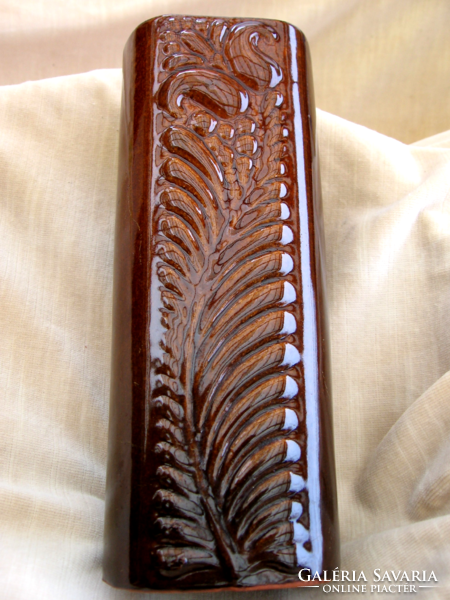 A brown, log-shaped, shiny vase by ditmar urbach?