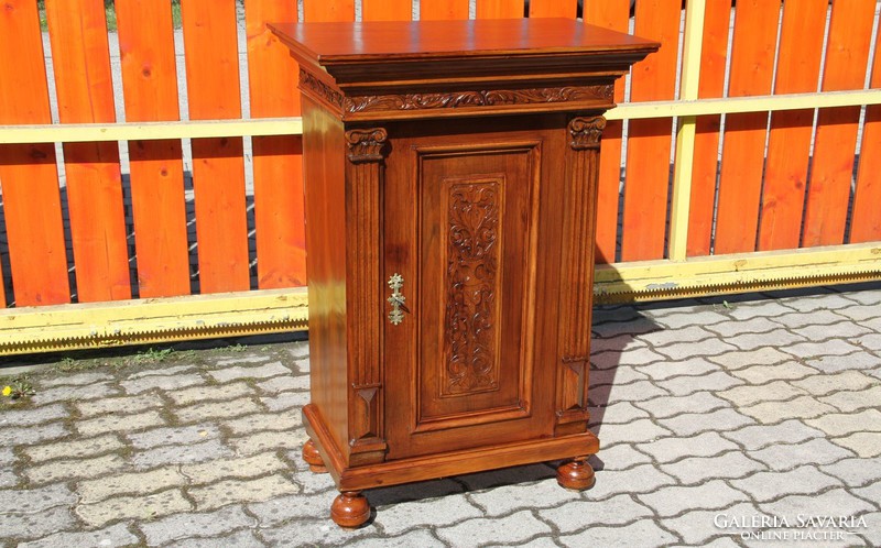 Old German richly carved chest of drawers