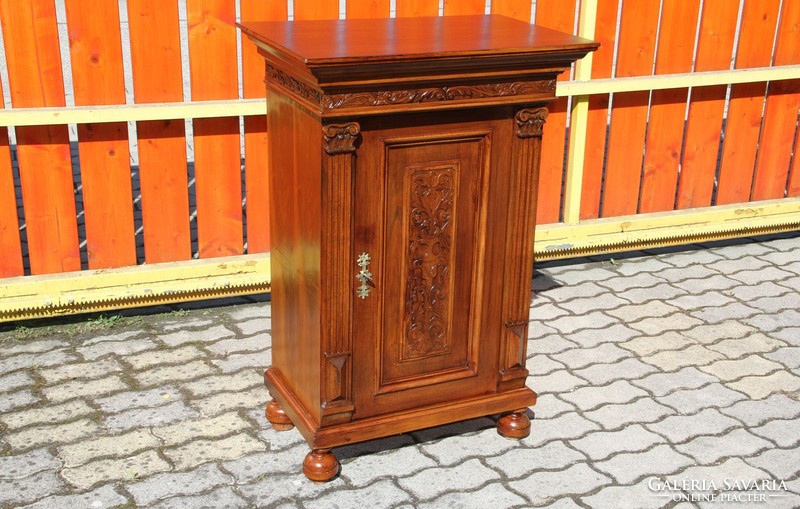 Old German richly carved chest of drawers