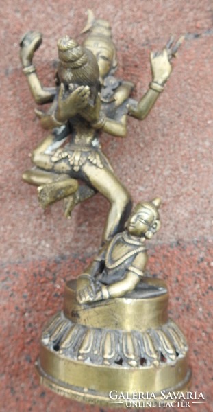 Antique bronze detail of three statues of oriental deities