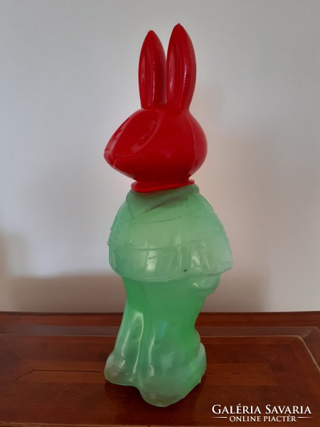 Retro rabbit in plastic candy wrap with dragee Easter bunny