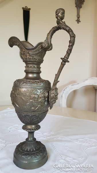 Antique pewter carafe with putty and faun head decoration