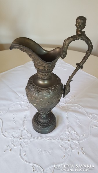 Antique pewter carafe with putty and faun head decoration